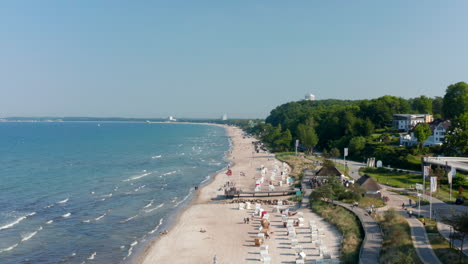Baltic-sea-beach-shoreline-aerial-drone-view-in--Scharbeutz,-Germany,-forward,-day